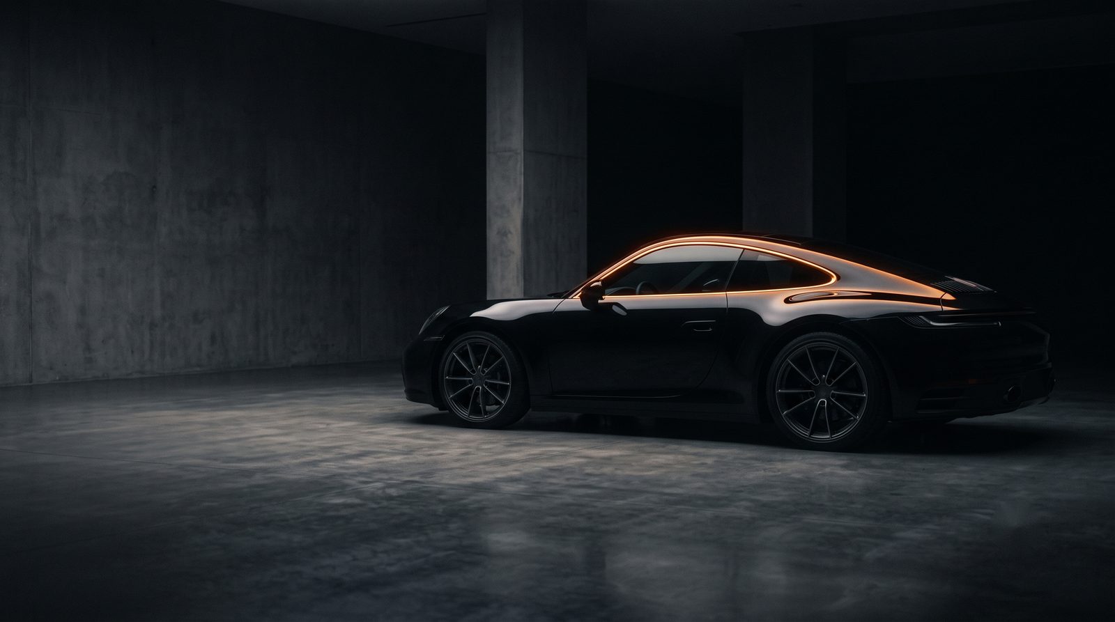 Porsche 911 in a concrete garage, an example of luxury and prestige vehicle finance NZ