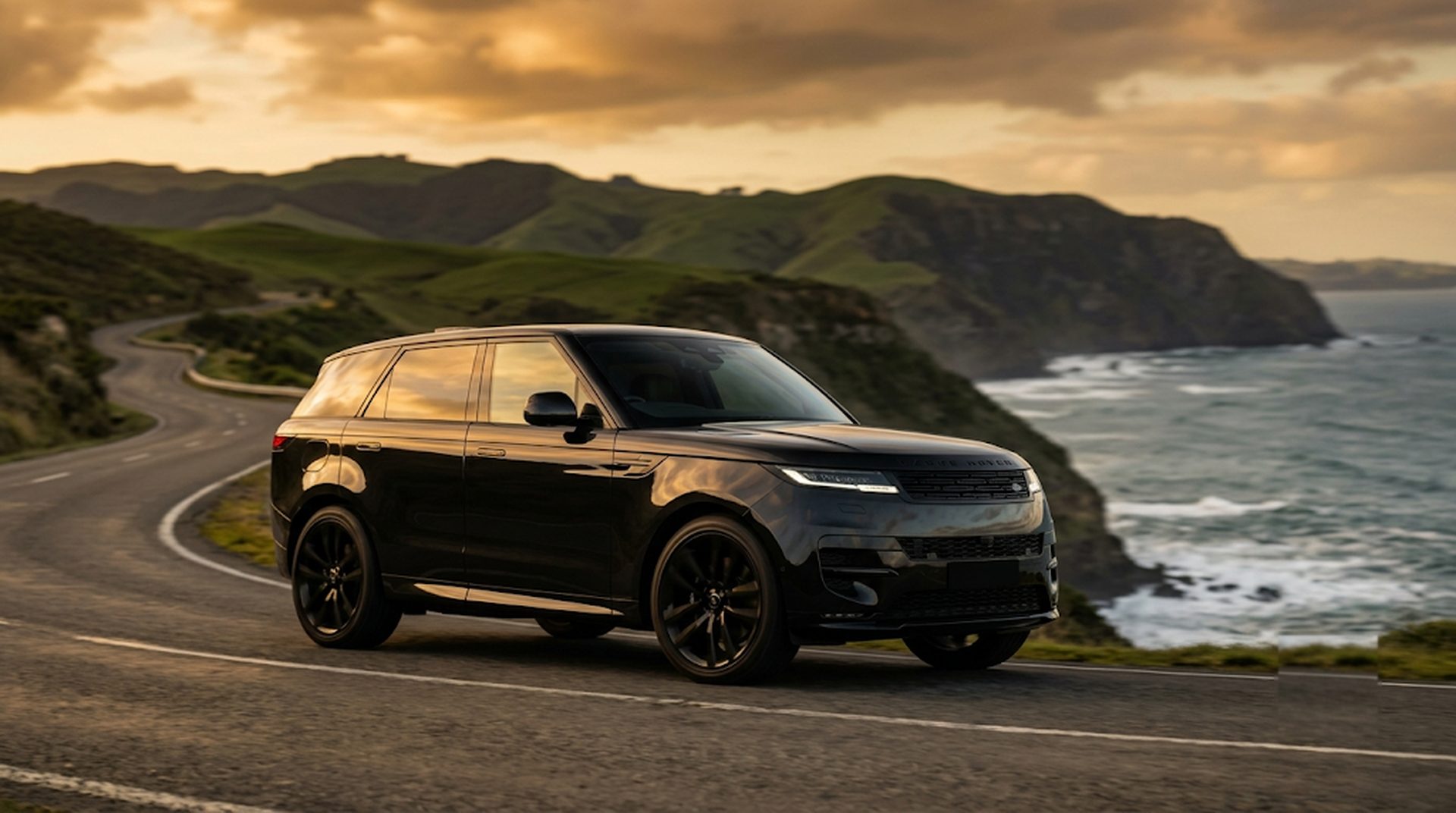 Black Range Rover Sport on NZ coastal cliff road at golden hour, financed by fundr