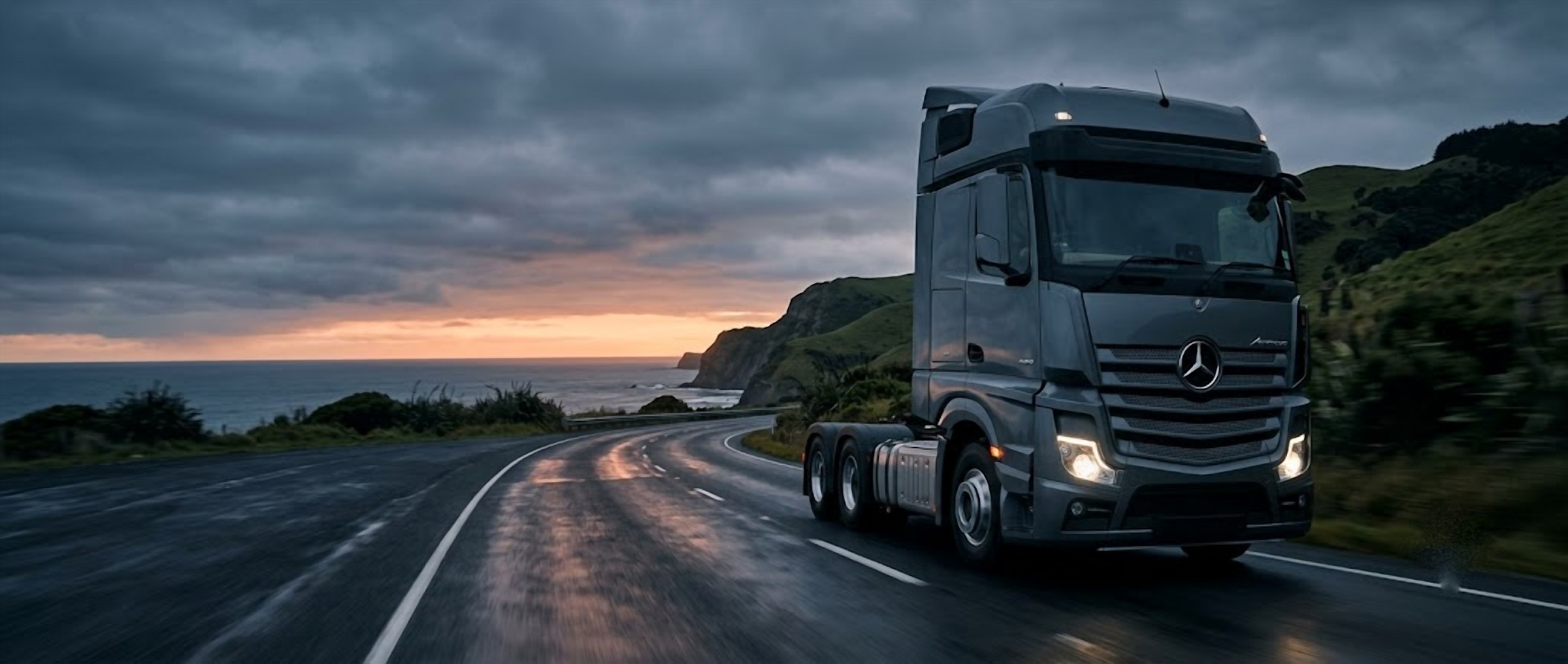 Mercedes-Benz prime mover truck driving along a New Zealand coastal highway at dusk — fundr finances vehicles, utes, trucks and equipment for NZ businesses